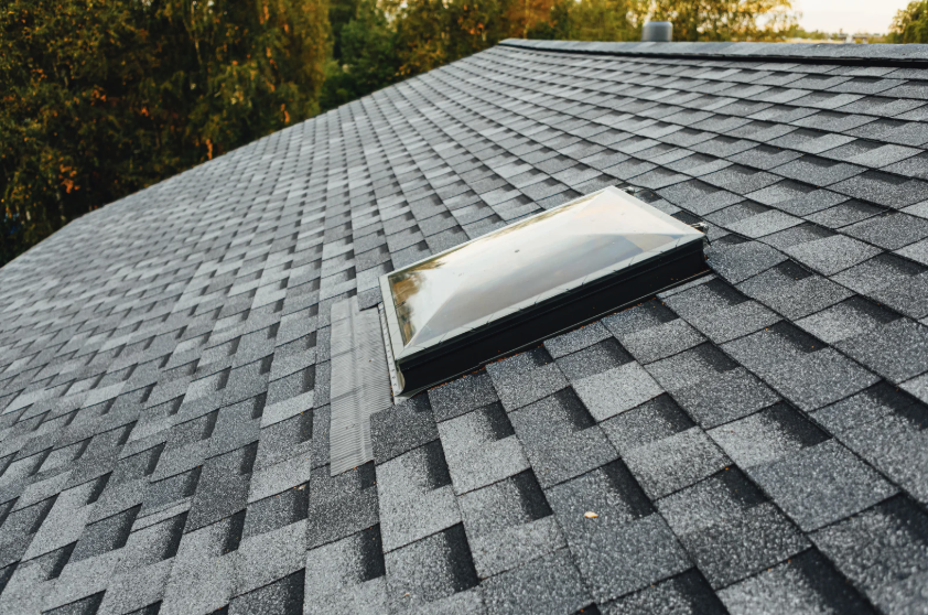 Thornton roofing completed job by Legacy Roofers with a skylight